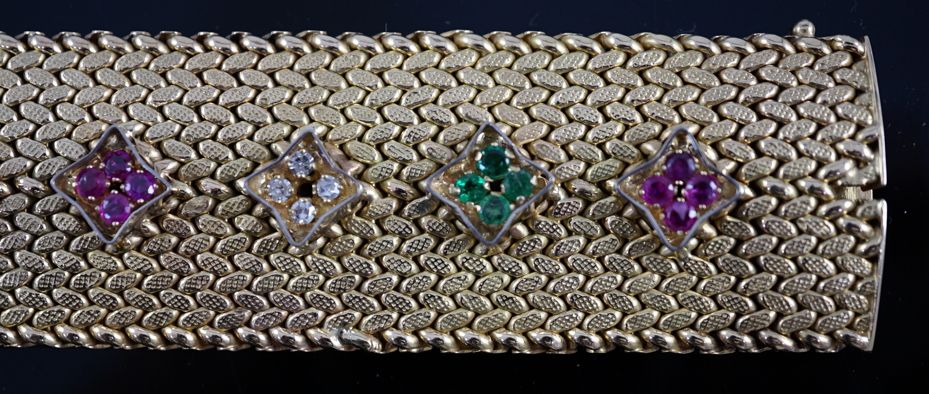 A mid 20th century Italian textured 18ct gold, ruby, emerald and diamond cluster set bracelet